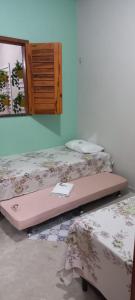 En eller flere senge i et værelse på Casa Serrana beach Camocim