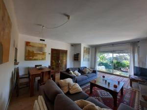 a living room with a couch and a table at Caldetas in Caldes d'Estrac