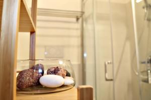 a bowl of donuts and eggs on a table at Casa MarJù in Montemassi +74 photos