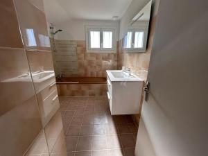 a bathroom with a sink and a toilet and a shower at Maison au coeur du Périgord Vert in Javerlhac-et-la-Chapelle-Saint-Robert +21 photos