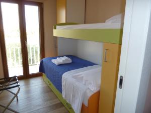 Кровать или кровати в номере Sole e mare