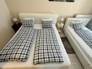 Postel nebo postele na pokoji v ubytování Princess City Centre Apartment