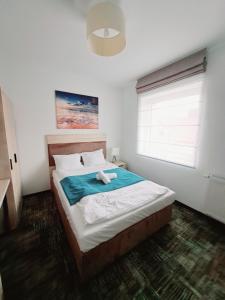 Postel nebo postele na pokoji v ubytování Apartament SUN w Welle