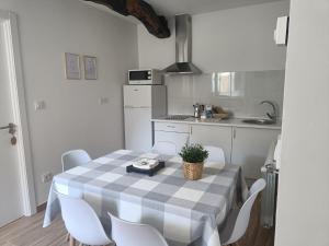 a kitchen with a table and chairs in a room at CASA A CALLE in O Pino 