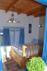 a bedroom with a wooden bed in a room at Villa Bellina in Pefki Rhodes