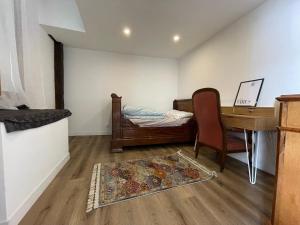 Postel nebo postele na pokoji v ubytování chambre cosy privée chez Franck