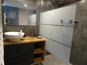 a bathroom with a sink and a mirror at gite les iris in La Robine