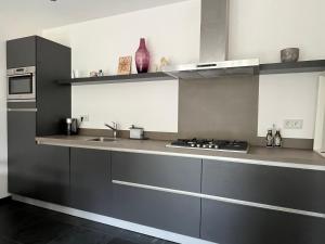 Virtuvė arba virtuvėlė apgyvendinimo įstaigoje Huisje36