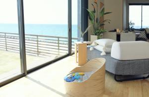 a living room with a view of the ocean at tramonto.blu in Tusi