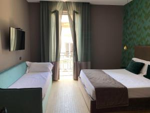 Postel nebo postele na pokoji v ubytování Re Sale Boutique Hotel