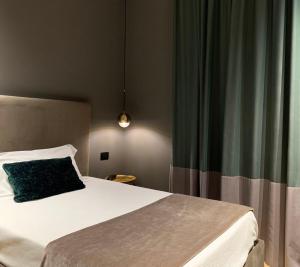 Postel nebo postele na pokoji v ubytování Re Sale Boutique Hotel