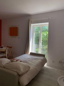 Ліжко або ліжка в номері Appartement cœur de village Numéro1