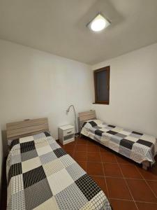 Ένα ή περισσότερα κρεβάτια σε δωμάτιο στο Casa Mario