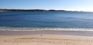 a view of the beach with the ocean at Dream House & Spa Bandol - Céline et Olivier in Bandol