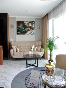 a living room with a couch and a table at ZB Apartment Luxor Bobrowniki Rogożnik Pyrzowice 