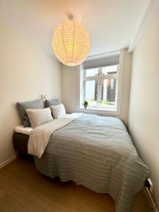 Postel nebo postele na pokoji v ubytování Knøsesmauet Apartment