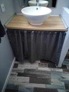 a bathroom with a sink and a counter top with a sink at Chaillot 6 in Saintes