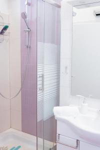 a bathroom with a shower and a sink at Apartment Tonka-Riva in Split
