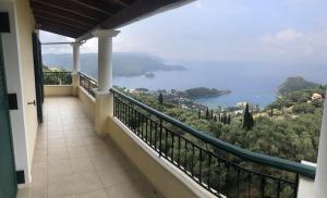 a balcony with a view of the ocean at Mariza's View House in Lákones