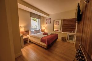 Postel nebo postele na pokoji v ubytování Hotel Schwarzbachtal Hideaway