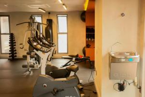 a gym with several tread machines in a room at Apartamento Palmeiras in Sao Paulo