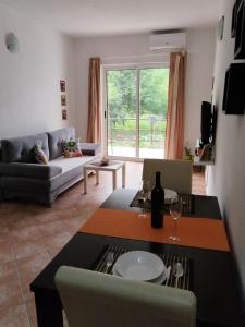 a living room with a couch and a table at Apartments Pasha in Blagaj