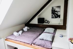 Postel nebo postele na pokoji v ubytování ŠUMAVSKÝ DVŮR