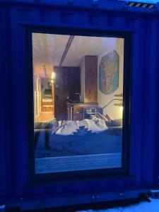 a picture of a bedroom with a bed in a room at Tiny House im Seecontainer mit Parkplatz, Glasfaser, Veranda und gehobener Ausstattung in Coburg