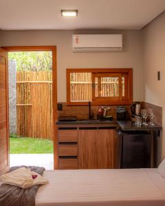 a kitchen with a sink and a counter top at Vila Diamantina in Mucugê