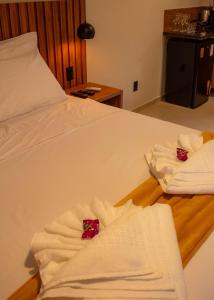 Uma cama ou camas num quarto em Vila Diamantina