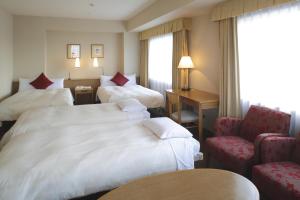 Postel nebo postele na pokoji v ubytování Dai-ichi Hotel Ryogoku
