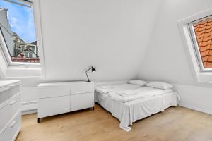 Postel nebo postele na pokoji v ubytování Modern penthouse with a view - Behind Bryggen