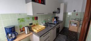 a kitchen with a sink and a counter top at Retica Tirano in Tirano