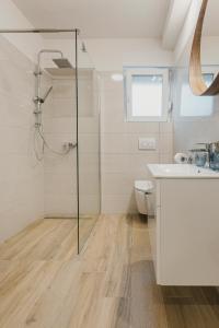 a bathroom with a shower and a sink at 3Level Apartments Kroatien in Umag