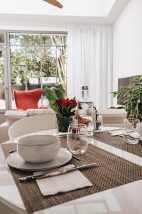 a dining room table with a plate of food on it at 64 Sur Le Mail in La Rochelle