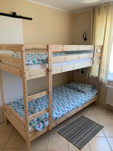 a bunk bed room with two bunk beds at Villa Malva in Karwia