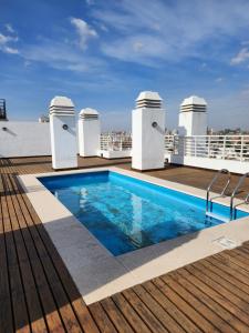 a swimming pool on the roof of a building at Altos de colon in Cordoba