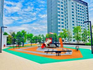 a park with a playground with a slide at Alanis Studio Suite  in Sepang