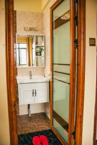 a bathroom with a sink and a mirror at Furnished 2 bedroom apartment in Kilimani in Nairobi