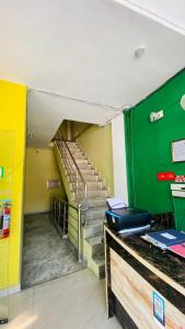 an empty room with a staircase in a building at OYO Flagship 12976 Hotel New Fiza in Jammu