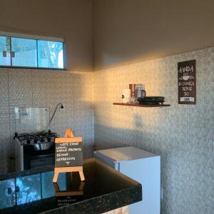 A kitchen or kitchenette at Chalés Recanto