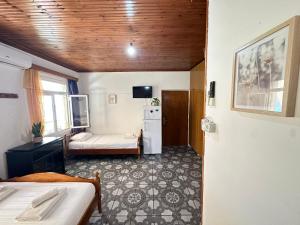 Postel nebo postele na pokoji v ubytování Boungainvillea