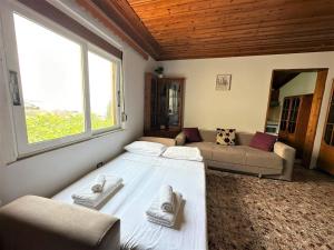 Postel nebo postele na pokoji v ubytování Boungainvillea