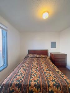 a large bed in a bedroom with a window at Shore Beach Houses - 52 - 401 Porter Avenue in Seaside Heights