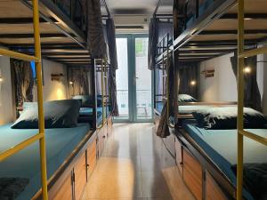 Postel nebo postele na pokoji v ubytování JOY HOSTEL