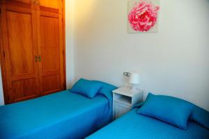 Postel nebo postele na pokoji v ubytování Villa Canamon