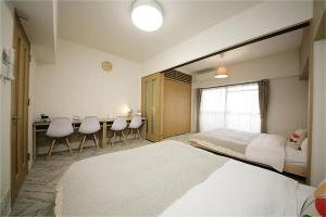Postel nebo postele na pokoji v ubytování goom Hotel Fukuoka-Tenjin