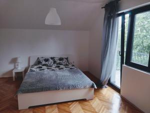 Кровать или кровати в номере Kosmajska Vila