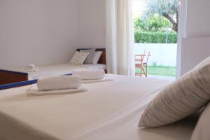 Postel nebo postele na pokoji v ubytování Lappas Rooms