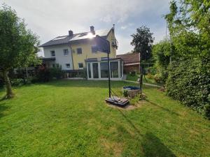 a house with a flag in the yard at Haus zur Sonne in Lindenberg im Allgäu